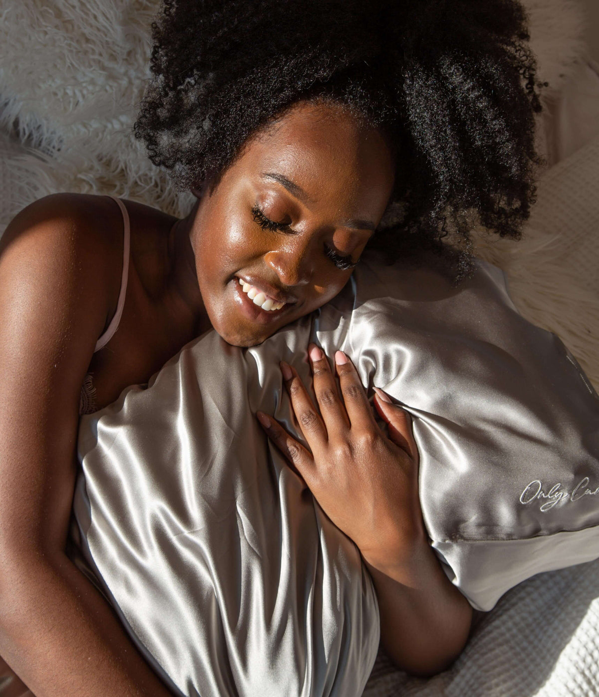 Only Curls Grey Silk Pillowcase - Yaayaa holding the soft pillow